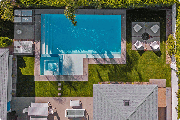 crop-payroll-clerk-counting-money-while-sitting-at-table_0000_beautiful-drone-photo-of-pool-in-backyard-8BDAW7Z
