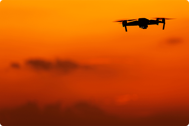 crop-payroll-clerk-counting-money-while-sitting-at-table_0004_unmanned-aerial-vehicle-drone-DBPPWR8